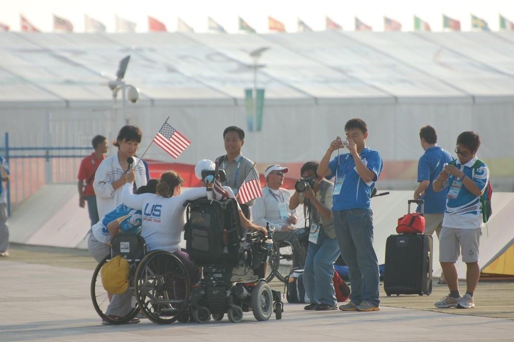 Nick Scandone and Maureen Mckinnon-Tucker winners of the Gold Medal, get the treatment from the local media after winning the Gold Medal for the USA in the SKUD 19 class at the 2008 Paralympics    © Dan Tucker http://sailchallengeinspire.org/